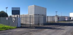 Front of storage yard with open gate